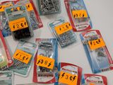 many different types of screws and nuts on the table
