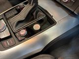 a close up of a car ' s gear knob and shift handle