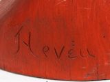a red vase with writing on it sitting on a table