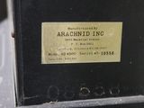 an old machine is sitting on a table with a label on it