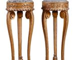 pair of carved wood pedestals with marble tops