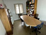 an image of a room with a table and chairs