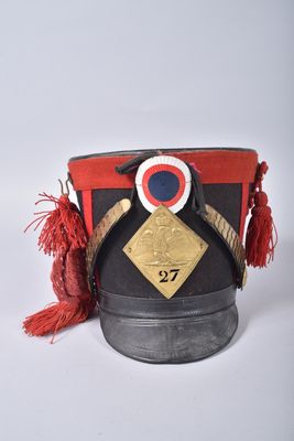 an image of a hat with a red tassel on top of it