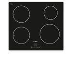 une plaque de cuisson noire avec quatre brûleurs et quatre brûleurs
