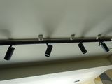 three lights that are hanging from the ceiling in a room