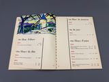 un livre ouvert sur lequel est dessiné une maison