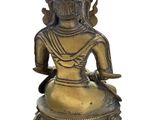 an image of a statue of a woman sitting on top of a table