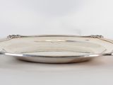 a silver plate that is sitting on a table