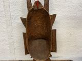 an image of a wooden sculpture of a bird on a table