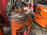 many different types of welding equipment in a garage