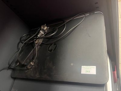a laptop computer sitting on top of a metal box