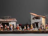 figurines d'une crèche dans une pièce sur fond noir
