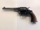 a close up of a revolver on a wall with a white background