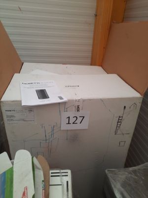 a box with a phone on top of it in a room
