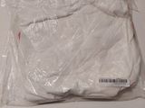 a bag of white clothing sitting on a table