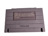 a gray nintendo game console sitting on top of a white table