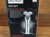 the box of the shaver is sitting on the wooden table