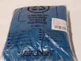 a bag of blue cloth sitting on a white table