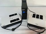 two power outlets and a charger on a bed