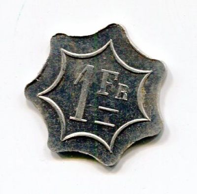 an image of a silver coin with the number 1 on it