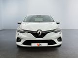 the front view of a white car in a white room