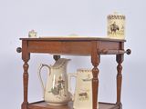a small table with two vases on top of it