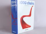 a book that has a red chair in front of it