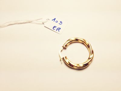 a gold ring with a price tag attached to it