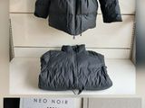 two pictures of a black jacket and a black jacket on a white table