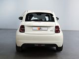 a white car that is parked in a room