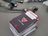 a stack of cards sitting on top of a table next to a pair of scissors