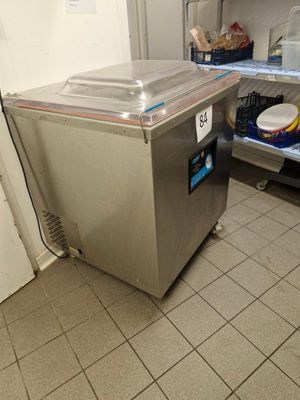 an image of a kitchen with a refrigerator and a dishwasher