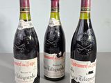 three bottles of wine sitting next to each other on a table