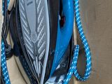 a box with a blue and white cord and a cell phone in it