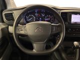 the interior of a car with a steering wheel and dashboard controls
