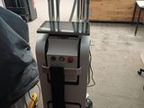 a machine that is sitting on a cart in a room