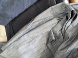 a pile of clothes sitting on top of a bed