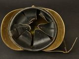 helmet of a soldier with a broken visor on a black background