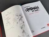 an open book with a drawing of a woman on it