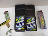 two boxes of toothbrushes and a box of toothpaste on a table
