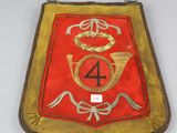an image of a red and gold plaque with the number four on it