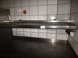 an image of a commercial kitchen with a stainless steel counter top