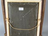 an old wooden easel with a chalk board on top of it