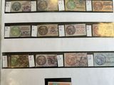 several different types of stamps on a sheet of paper on a table
