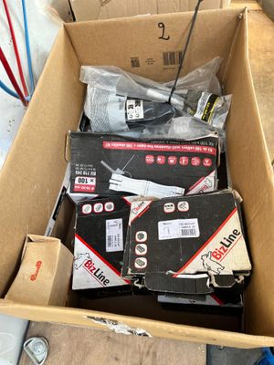 a box full of assorted batteries and wires