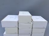 several white boxes stacked on top of each other on a gray surface