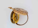 a gold pocket watch on a white background