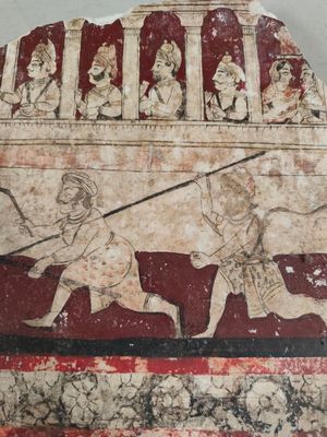 une image représentant une peinture accrochée au mur d'un immeuble et sur laquelle figurent des personnages
