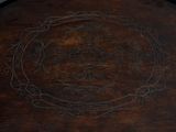 a wooden tray with a decorative design on it