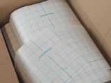 a cardboard box with a sheet of paper inside of it